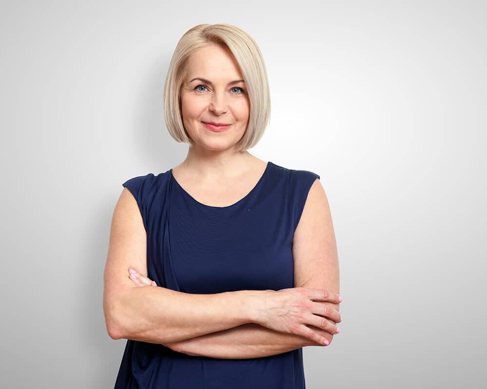 Woman Smiling With Arms Crossed